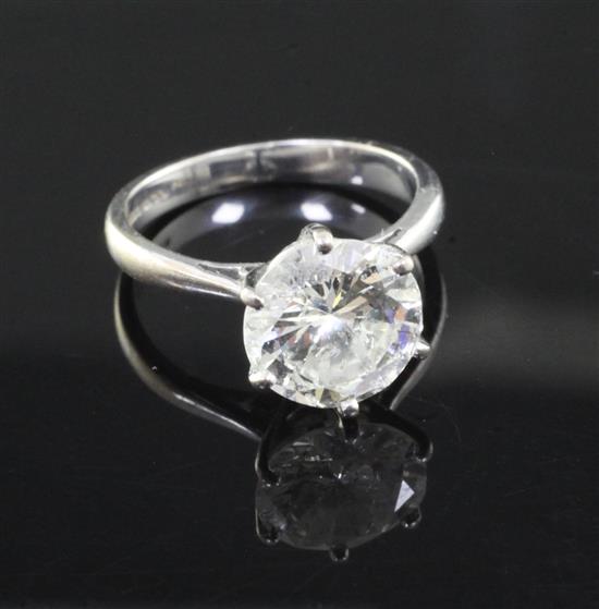 An 18ct white gold and solitaire diamond ring, size J/K.